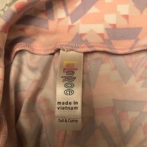 Lularoe “TC” tall and curvy leggings with pink and purple aztec design.